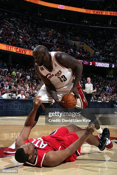 Shaquille O'Neal of the Cleveland Cavaliers draws the shooting foul by Jason Collins of the Atlanta Hawks on December 30, 2009 at The Quicken Loans...