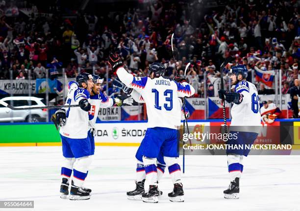 Slovakia's Andrej Sekera is congratulated by teamates after scoring a goal during the group A match Czech Republic vs Slovakia of the 2018 IIHF Ice...