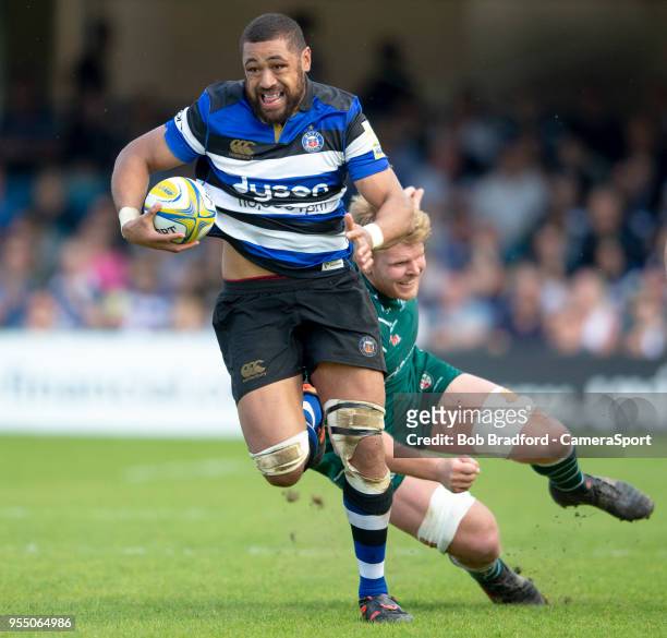 Bath Rugby's Taulupe Faletau evades the tackle of London Irish's Joshua McNally during the Aviva Premiership match between Bath Rugby and London...