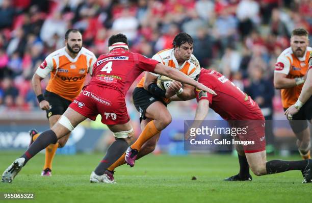 Francois Venter of Cheetahs is tackled by Lewis Rawlins of Scarlets and Ken Owens of Scarlets during the Guinness Pro14 match between Scarlets and...