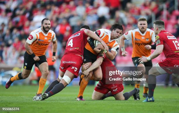 Francois Venter of Cheetahs is tackled by Lewis Rawlins of Scarlets and Ken Owens of Scarlets during the Guinness Pro14 match between Scarlets and...