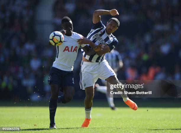 Davinson Sanchez of Tottenham Hotspur and Jose Salomon Rondon of West Bromwich Albion tussle for the ball during the Premier League match between...