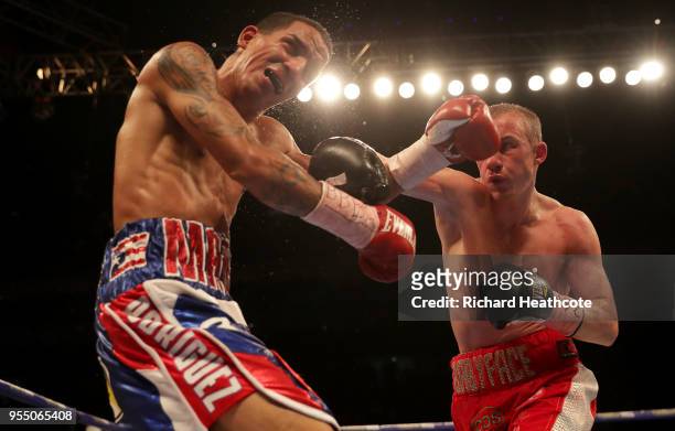 Paul Butler punches Emmanuel Rodriquez during the IBF World Bantamweight Championship title fight between Paul Butler and Emmanuel Rodriguez at The...