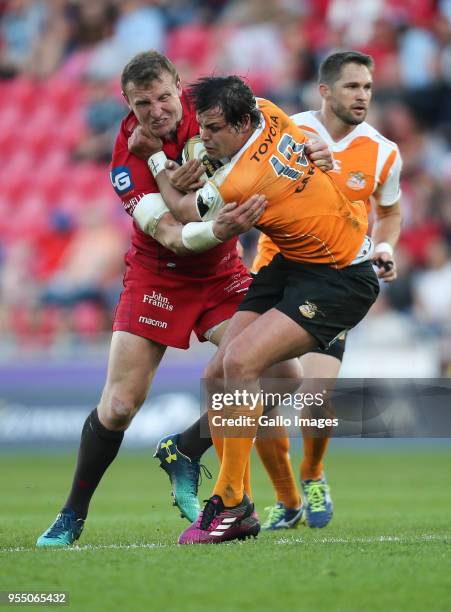 Francois Venter of Cheetahs is held by Hadleigh Parkes of Scarlets during the Guinness Pro14 match between Scarlets and Toyota Cheetahs at Parc y...