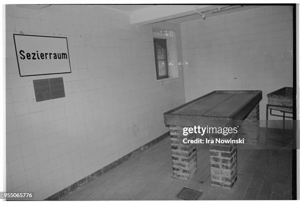 Examining table in camp morgue, Examining table in morgue at Mauthausen, a Nazi concentration camp in operation during World War II. Over 100, 000...