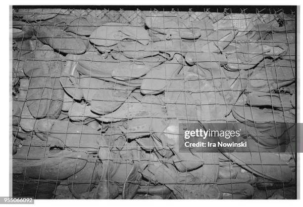 Victims' shoes at concentration camp, An exhibit featuring a pile of thousands of prisoners' shoes serves as a reminder of the victims who perished...