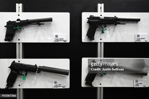 Sig Sauer hanguns with silencers are displayed during the NRA Annual Meeting & Exhibits at the Kay Bailey Hutchison Convention Center on May 5, 2018...