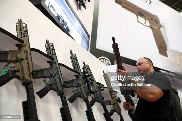 Sig Sauer rifles are displayed during the NRA Annual Meeting & Exhibits at the Kay Bailey Hutchison Convention Center on May 5, 2018 in Dallas,...