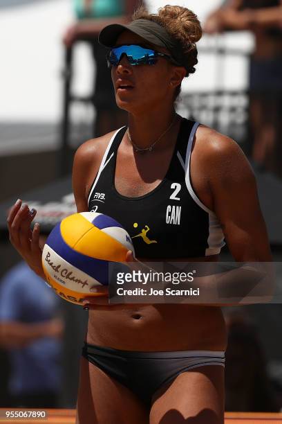 Brandie Wilkerson of Canada prepares to serve the ball during the match against Brooke Sweat and Lauren Fendrick of USA at the Huntington Beach Open...