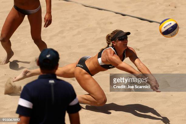 Heather Bansley of Canada dives for the ball during the match against Brooke Sweat and Lauren Fendrick of USA at the Huntington Beach Open on May 5,...