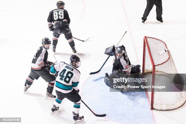 Charlie Huber of Cathay Flyers battle in the goal mouth with Jimmy Bjennmyr of Nordic Vikings Goalie during the Mega Ice Hockey 5s International...