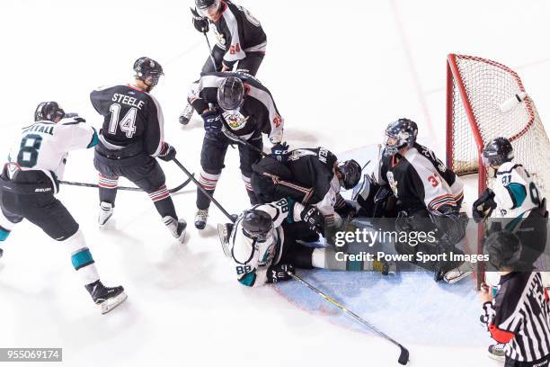 Drew Barton of Cathay Flyers battle in the goal mouth with Jimmy Bjennmyr of Nordic Vikings Goalie during the Mega Ice Hockey 5s International Elite...