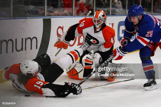 Scott Hartnell of the Philadelphia Flyers and goal keeper Michael Leighton defend against Erik Christensen of the New York Rangers during their game...