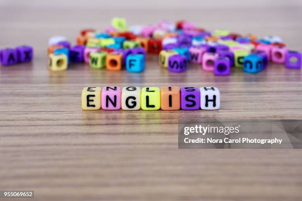 english word and alphabet letter beads - english language fotografías e imágenes de stock