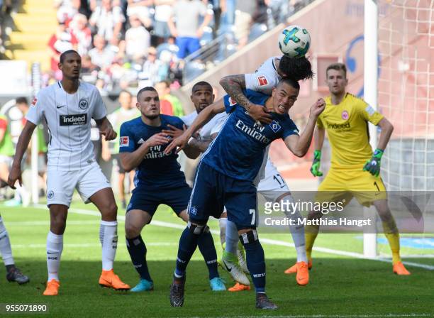 Bobby Wood of Hamburg jumps for a header with Carlos Salcedo of Frankfurt during the Bundesliga match between Eintracht Frankfurt and Hamburger SV at...