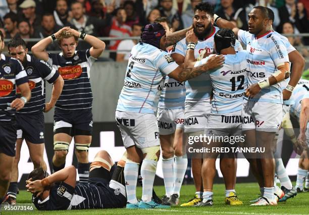 Racing 92's second row from Tonga Edwin Maka is congratulated by teammates during the French Top 14 rugby union match between Racing 92 and SU Agen,...