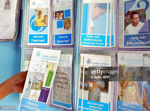 Timorese man looks at a brochure about HIV/AIDS at a clinic in Dili on December 18, 2009. The tiny nation of East Timor could face a deadly AIDS...