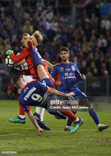 Roy O'Donovan of the Jets collides with Lawrence Thomas of the Victory during the 2018 A-League Grand Final match between the Newcastle Jets and the...