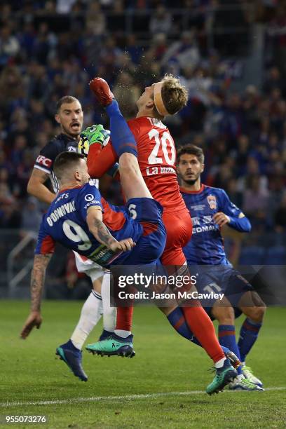 Roy O'Donovan of the Jets collides with Lawrence Thomas of the Victory during the 2018 A-League Grand Final match between the Newcastle Jets and the...