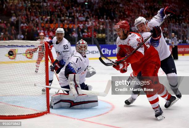 Peter Regin of Denmark and Connor Murphy of United States battle for the puck during the 2018 IIHF Ice Hockey World Championship group stage game...