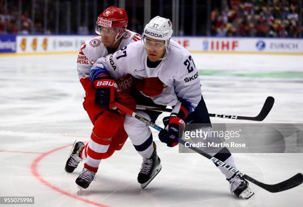 Jesper Jensen of Denmark and Anders Lee of United States battle for the puck during the 2018 IIHF Ice Hockey World Championship group stage game...