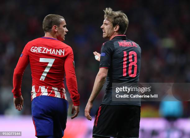 Antoine Griezmann of Atletico Madrid and Nacho Monreal of Arsenal during the UEFA Europa League Semi Final second leg match between Atletico Madrid...