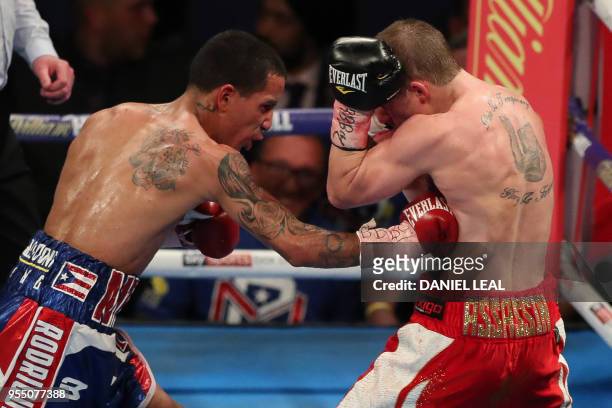 Puerto Rico's Emmanuel Rodriquez fights Britain's Paul Butler in their IBF bantamweight contest at The O2 Arena in London, England, on May 5, 2018. -...