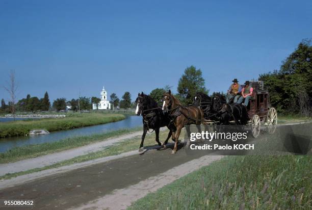 Charrette tirée par des chevaux au musée folklorique ?Upper Canada Village? à Morrisburg, en 1975, en Ontario, Canada.