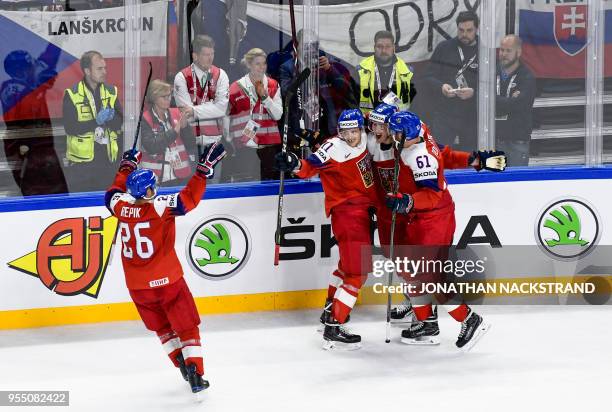 Czech Republic's Dmitrij Jaskin is congratulated by teamates after scoring the game-winning goal during the 2018 IIHF Men's Ice Hockey World...