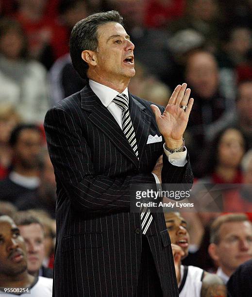 Head coach Rick Pitino of the Louisville Cardinals gives instructions to his team during the Big East Conference game against the South Florida Bulls...