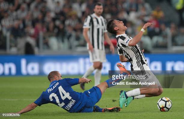 Paulo Dybala of Juventus FC is challenged by Rodrigo Palacio of Bologna FC during the serie A match between Juventus and Bologna FC at Allianz...