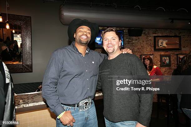 Cowboy Troy and Storme Warren attend The Bashing Guitars event at the Hard Rock Cafe Nashville grand re-opening and Guitar Smash on December 30, 2009...