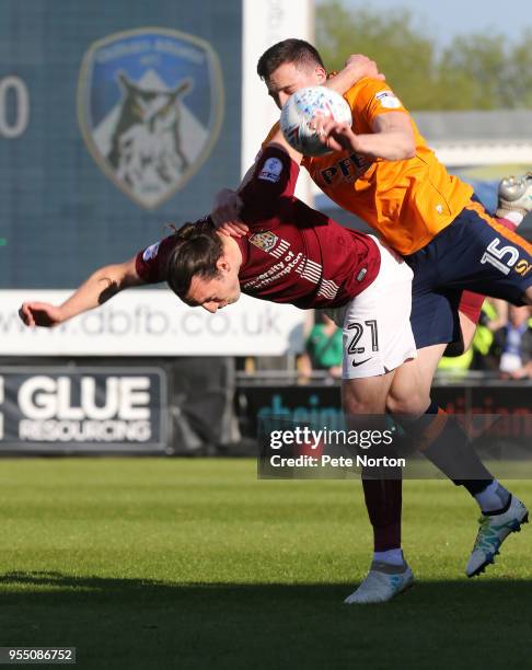 John-Joe O'Toole of Northampton Town contests the ball with George Edmundson of Oldham Athletic during the Sky Bet League One match between...