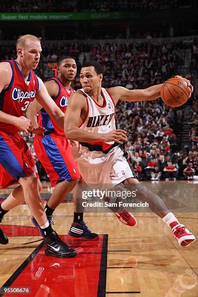 Brandon Roy of the Portland Trail Blazers drives against Chris Kaman of the Los Angeles Clippers during a game on December 30, 2009 at the Rose...