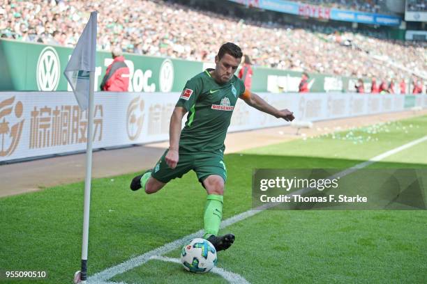 Zlatko Junuzovic of Bremen kicks the ball during the Bundesliga match between SV Werder Bremen and Bayer 04 Leverkusen at Weserstadion on May 5, 2018...