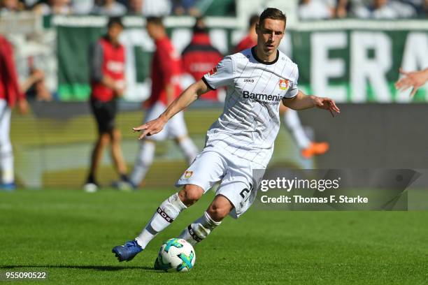 Dominik Kohr of Leverkusen runs with the ball during the Bundesliga match between SV Werder Bremen and Bayer 04 Leverkusen at Weserstadion on May 5,...