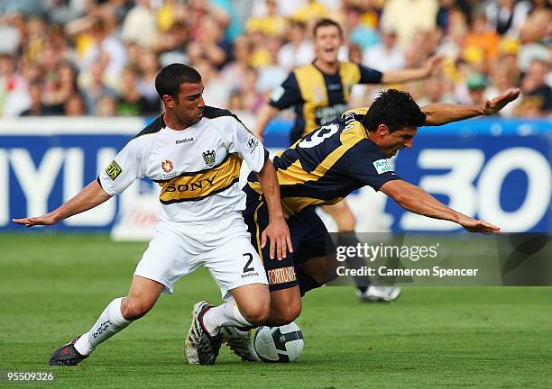 Emmanuel Muscat of the Phoenix contests the ball with Nik Mrdja of the Mariners during the round 21 A-League match between the Central Coast Mariners...