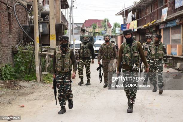 Indian army patrolling and standing guard near the Encounter site in Srinagar. 4 Killed and several injured in an encounter between Indian forces and...