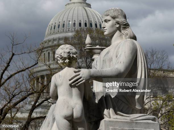 Statue outside the Rayburn House Office Building in Washington, D.C. Is titled 'The Spirit of Justice.' In the background is the United States...