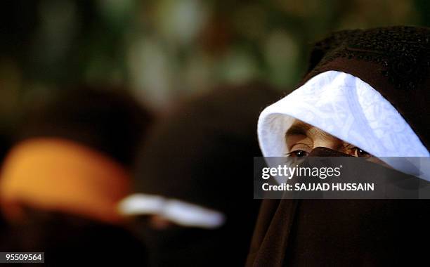 In this picture taken on April 30 Chief of Kashmiri Islamic women seperatist group Dukhatran-e-Milat Aasiya Andrabi addresses a news conference in...