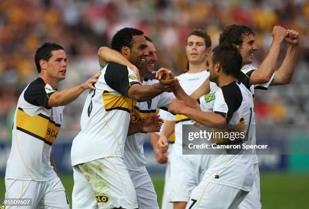 Paul Ifill of the Phoenix celebrates with team mates after scoring a goal during the round 21 A-League match between the Central Coast Mariners and...