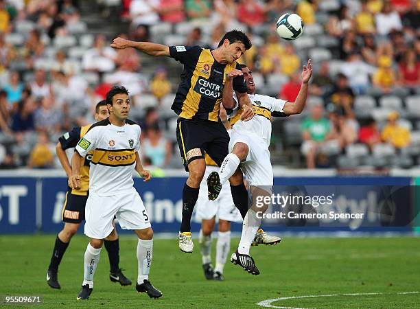 Nik Mrdja of the Mariners heads the ball with Emmanuel Muscat of the Phoenix during the round 21 A-League match between the Central Coast Mariners...