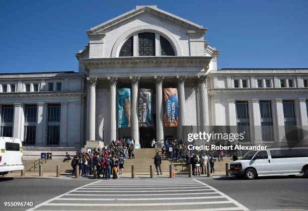 Students visiting Washington, D.C. Wait in line to enter the National Museum of Natural History on the National Mall. The nature-history museum is...