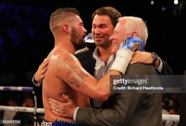 Tony Bellew celebrates victory with Eddie Hearn and Barry Hearn after Heavyweight fight between Tony Bellew and David Haye at The O2 Arena on May 5,...