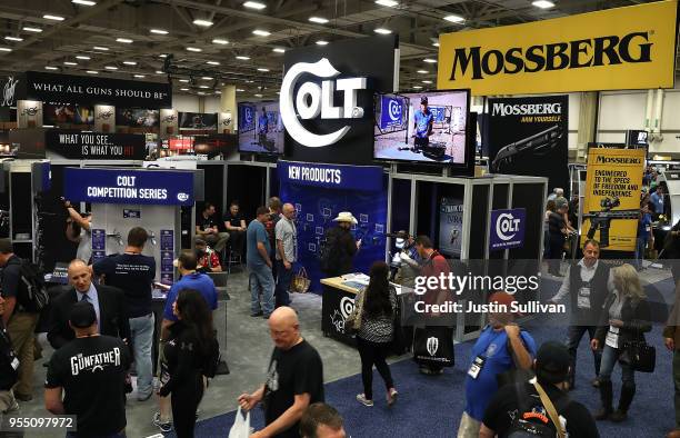 Attendees walk the show floor during the NRA Annual Meeting & Exhibits at the Kay Bailey Hutchison Convention Center on May 5, 2018 in Dallas, Texas....
