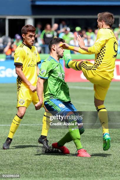 Alex Roldan of Seattle Sounders is kicked in the face by Pedro Santos of Columbus Crew in which would result in a red card in the first half during...