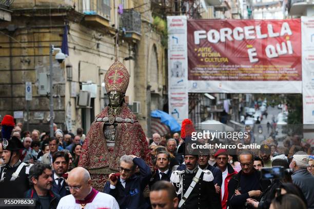 The bust of San Gennaro during the procession of the patron saint in the streets of Naples. Here in Forcella street.