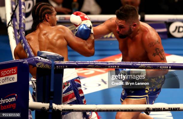 Tony Bellew punches David Haye during Heavyweight fight between Tony Bellew and David Haye at The O2 Arena on May 5, 2018 in London, England.