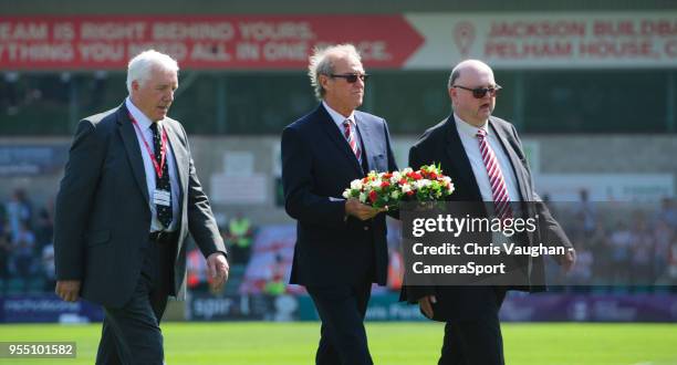 Lincoln City chairman Bob Dorrian, centre, is joined by Former Imps Players Association chairman Trevor Swinburne, left, and chairman of the Red Imps...