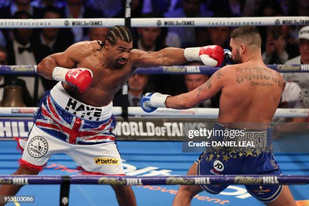 British boxer David Haye delivers a straight left against countryman Tony Bellew during their heavyweight rematch at the O2 Arena in London on May 5,...